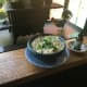 Cut up walnuts into smaller pieces, and add 5 cloves minced garlic, minced cilantro, 4 tablespoons lemon juice, 1 cup chicken stock, coriander, fenugreek, cayenne pepper, and salt to taste. Blend in a blender or food processor to make a paste. Let ag