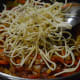 step eight: Add fried noodles. Mix well.