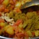 Step four: Add coriander powder, red chili powder, garam masala powder, dry mango powder, turmeric powder, and salt.
