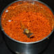 Step three: Grind mustard seeds and dry red chili with grated coconut.