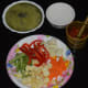 Step two: Extract juice from mint leaves, chop the vegetables, and coarsely grind red chili, ginger, and garlic