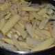 Add the baby corn pieces and continue stir-cooking.