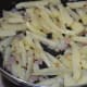 Stir-fry the chopped potato.