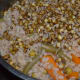 Step two: Cook for 5 minutes after a whistle. Turn off the fire. By now, brown rice cooks nicely with mung beans and the veggies.