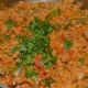 Step six: Pour lemon juice or tamarind pulp. Add chopped coriander leaves and grated coconut. Mix well. Turn off the fire.