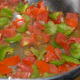 Step four: Add chopped capsicum and tomato. See that tomato does not become mushy.