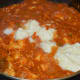 Step six: Add milk cream. Mix once. Turn off the fire after a few seconds.