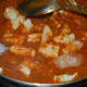 Step five: Pour some water and boil the gravy. Add sugar and salt. Also add paneer cubes. Simmering continues.