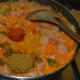 Add all the spices and mix well. Check the taste and add a little sugar or more salt if needed. Boil for 6 minutes. Add the chopped coriander leaves. Transfer the curry to a serving dish.