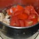 Grind the tomato, cashew nuts, ginger, and garlic into a puree.