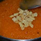 Step 8: The dessert should start leaving the sides of the pan. Add sauteed cashew pieces. Turn off the heat.