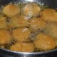 Step three: Dip the slices in the batter and deep fry them in hot oil.
