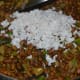 Step six: Add grated coconut and chopped coriander leaves. Mix thoroughly.
