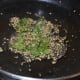 Step seven: Prepare tempering. Heat oil and add mustard seeds, sesame seeds, hing, and curry leaves. Let the mustard crackle.