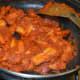 Step nine: Add coriander powder, amchur powder, and garam masala powder.