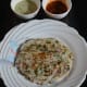 Serve hot with coconut chutney. Enjoy eating your crunchy onion pancake!