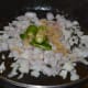 Step three: Saute onion, ginger, and slit green chilies in oil.
