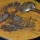 Step nine: Add pepper powder and dried oregano leaves. Stir well.