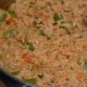 Step 6: Add cooked rice and beans. Gently mix.