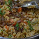 Step 7: Mix 3/4 portion of fried onion juliennes and chopped coriander to the pulao.