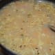 Step five: Pour 4 cups of water and add salt. Also add corn flour mix.