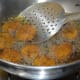 Step four: Fry them in very hot oil until golden brown and crunchy. Remove and place them on a paper towel.