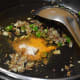 Add turmeric powder, hing, and garam masala powder. Mix well.