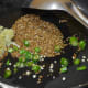 Step one: Saute cumin, carom seeds, ginger-garlic paste, and green chilies in oil.