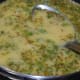 Step two: Add gram flour and semolina batter into the pan. Stir-cook on low fire, stirring continuously.