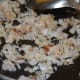 Step three: Saute cumin seeds in oil. Add onion and saute until golden brown.