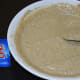 Steps 2 and 5: Gently mix fruit salt or baking soda into the batter. Pour the batter into the greased container.