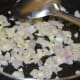 Step two: Saute chopped garlic and onion in butter.