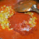 Step four: Add boiled corn kernels, red chili powder, sugar, and salt. Mix and boil.