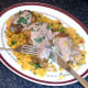 Enjoying turmeric baked chicken thighs and rice with spicy sauce
