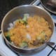 Broccoli and cauliflower are stirred in to rice