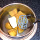Turmeric potatoes are mashed with butter
