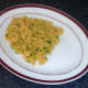 Turmeric rice bed is arranged on serving plate