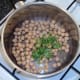 Coriander is added to drained chickpeas