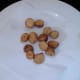 Fried potatoes are drained on kitchen paper