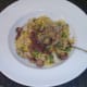 Enjoying chicken and mushroom turmeric fried rice with red onion gravy