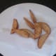 Twice fried wedges are drained for service