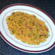 Rice bed is formed for chicken thighs