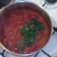Chopped coriander is added to turkey curry