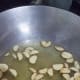 Add the garlic to the pan and cook until it becomes light brown.