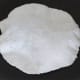 Step 3: Pinch out a lemon-sized ball of dough and roll it into a 6–7 inch diameter disc, dusting with rice flour. Cook both sides for a minute on a hot pan. Then, hold it directly above the flame. The roti should puff up. Keep it aside.