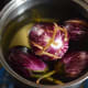 Step one: Slit the eggplants vertically and immerse in water.
