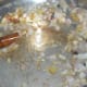 Step three: Add chopped onions, garlic, and ginger. Saute till onion turns transparent