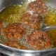 Step five: Deep fry them in hot oil. Turn them occasionally to ensure uniform cooking. Remove, when they turn golden brown on all sides. Place them on a tissue paper.
