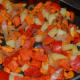 Step six: Add chopped red capsicum. Continue stir-cooking for a while.