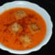 Step twelve: Tomato and sweet pepper soup is ready. Pour it equally into four bowls. Garnish with breadcrumbs and Kashmiri red chili powder. Enjoy sipping this delicious hot soup!